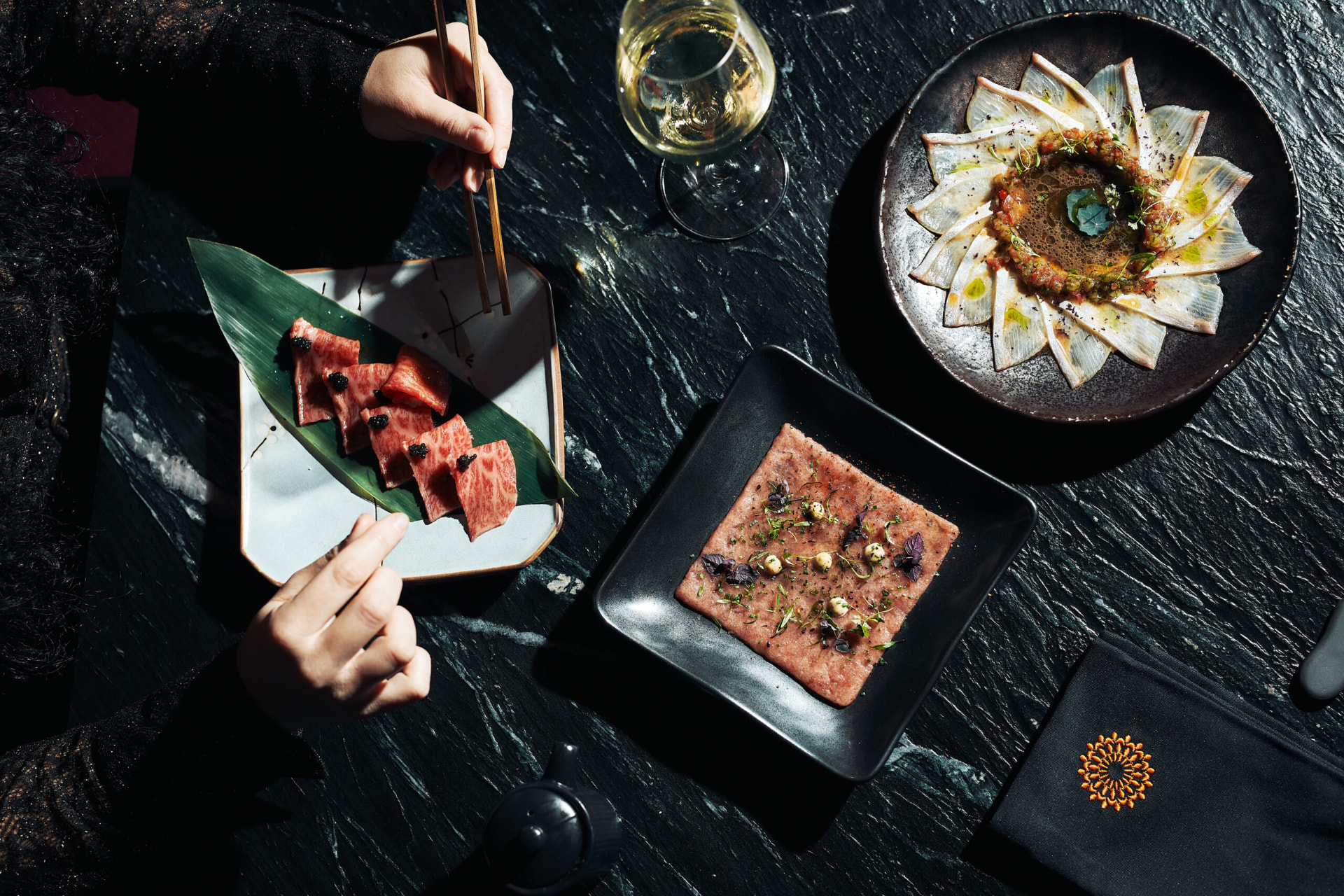 A Kiku dish plated on artisanal ceramic